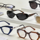 Assorted luxury, mid-tier, and budget eyewear frames displayed on a neutral development table, with color swatches, metal components, and technical drawings illustrating 2026 OEM/ODM eyewear trends from Vietnam.