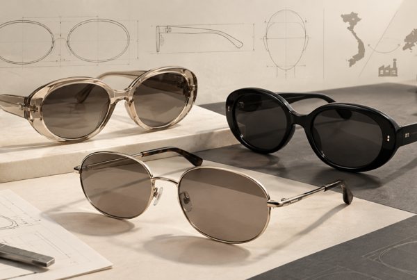 Three oversized oval sunglasses in bio-acetate, dark acetate, and lightweight metal frames displayed on a neutral studio surface.