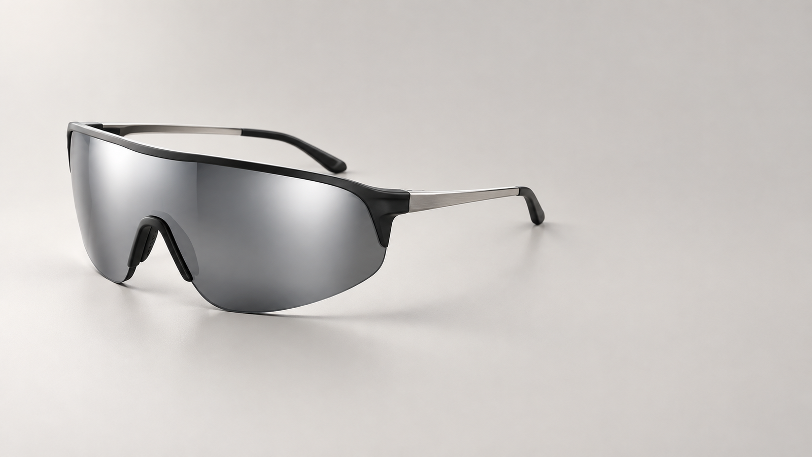 Futuristic black wraparound shield sunglasses with a mirrored smoke lens, designed for 2026 OEM/ODM collections