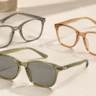 Three translucent soft-square eyewear frames in smoke gray, caramel amber and muted olive, with the olive frame fitted with gray sun lenses.