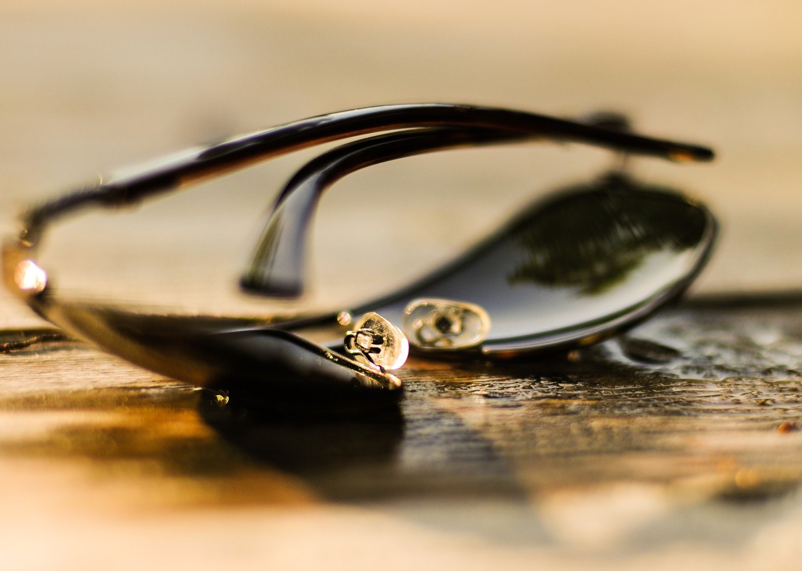 Eyewear open-to-buy plan: unbranded aviator sunglasses on wood for optical–sun buy wave allocation, no brand marks