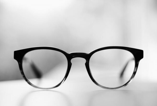 Unbranded black-to-clear injection optical frame on white, Japan injection eyewear by Concept Eyewear